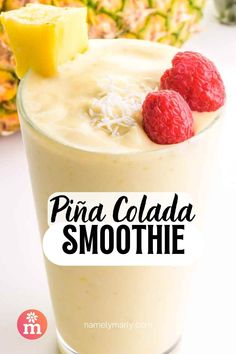 pina colada smoothie with raspberries and pineapple on the side