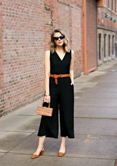 How To Wear Black Over 50, Wear Black In Summer, How To Wear Jumpsuit, Styling Black Jumpsuit, How To Style A Black Jumpsuit, Jumpsuit Work Outfit, Black Culottes Outfit, Black Jumpsuits For Women, Spring Activewear