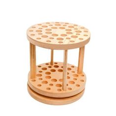 two wooden stools with holes on them