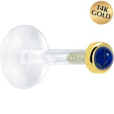 an image of a glass door knob with a gold plated handle and blue stone