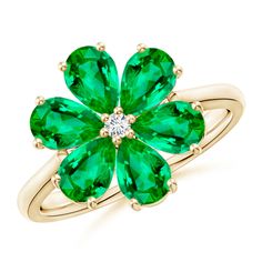 Featuring a classic six-petal design, this flower ring represents the innate beauty of nature. The pear-shaped rich green emeralds are prong set in a floriated pattern with a glittering round diamond accent at the center. This timeless and elegant emerald cocktail ring in 14k yellow gold is designed with a polished reverse tapered shank. Emerald Cocktail Ring, Emerald Cocktail, Diamond Flower Ring, May Birthstone Rings, Pear Ring, Art Deco Engagement Ring, Diamond Flower, Flower Ring, Emerald Diamond