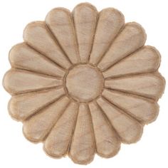 a beige flower shaped rug on a white background