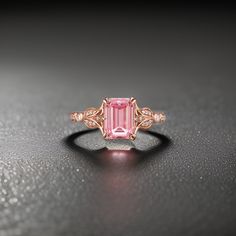 sterling silver, diamond, diamond ring, pink sapphire, pink sapphire ring, emerald cut engagement rings, vintage sapphire ring, emerald cut Step into a realm of timeless elegance and sophistication with our Vintage Emerald Cut Pink Sapphire Engagement Ring, a symbol of enduring love and exquisite craftsmanship. Crafted to perfection, this stunning ring features a mesmerizing pink sapphire at its center, cut into a dazzling emerald shape. Paired with shimmering CZ side stones, this ring is a testament to refined beauty and refined taste. Engagement ring Center Stone - Pink Sapphire Cut - Emerald Size - 6x8mm Side Stone - Cubic Zirconia Cut - Round Weight - 0.106ct Clarity - SI-VS Color- G-H Band width - 1.8mm Celebrate your love story with our Vintage Emerald Cut Pink Sapphire Engagement Ri Pink Sapphire Wedding Ring Set, Pink Sapphire Rings, Unique Pink Engagement Rings, Vintage Sapphire Ring, Emerald Cut Engagement, Vintage Sapphire