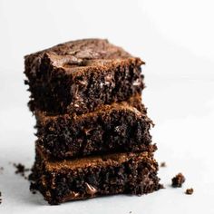 three chocolate brownies stacked on top of each other