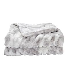 two blankets stacked on top of each other in grey and white fur, with one blanket folded