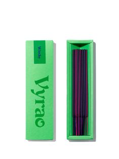 the green box is full of incense sticks