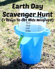 an earth day scavenger hunt in a blue bucket on the grass with text overlay