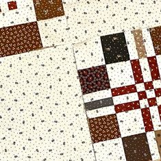 the quilts are all different colors and patterns on the table top, but one is brown