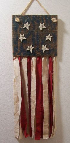 an american flag hanging on a wall