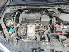 the engine compartment of a car with its hood open