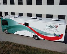 an rv parked in front of a building