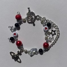 a bracelet with charms and beads on it