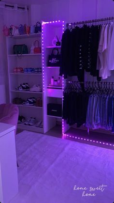 the closet is lit up with purple lights