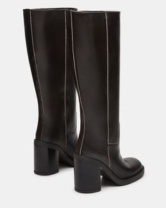 Elevate your style with the WESTLEY boot. With a versatile knee-high design and comfortable block heel, these boots will keep you looking chic and feeling confident all day long. Perfect for any occasion, these are a must-have addition to your shoe collection. 3.75 inch heel height 15 inch shaft circumference 13.25 inch shaft height Leather upper material Synthetic lining Synthetic sock Synthetic sole Fit tip: If you are in between sizes, size up a half-size Imported Casual Knee-high Boots With Wide Calf And Square Toe, Trendy Tall Platform Boots For Fall, Casual Mid-calf Heeled Boots For Work, Trendy Wide Calf Knee-length Boots, Trendy Tall Mid-calf Boots For Fall, Trendy Leather Knee-high Boots, Trendy Leather Knee-high Boots With Block Heel, Trendy Knee-high Boots With Block Heel For Fall, Trendy Leather Knee-high Heeled Boots