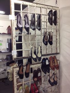 there are many pairs of shoes on display