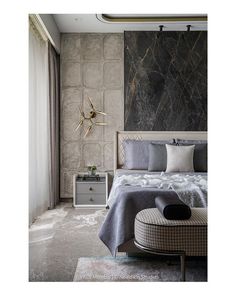 a bedroom with marble walls and flooring