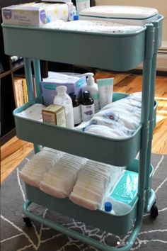 three tiered cart with baby products on it