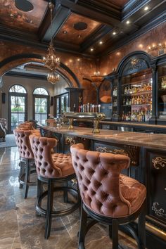 an elegant bar with brown leather chairs and chandelier