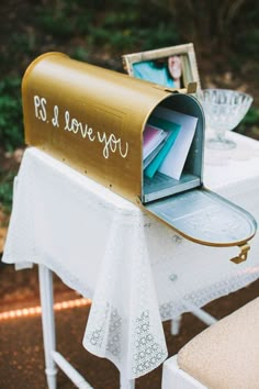 an open mailbox sitting on top of a table