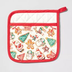 a red and white oven mitt with christmas decorations on it's front pocket