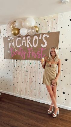 a woman standing in front of a sign that says icaro's twenty first