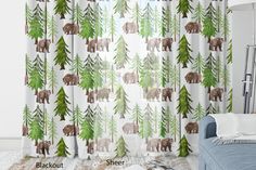 an animal themed window curtain with bears and pine trees on the outside, in front of a white background