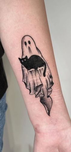 a black and white drawing of a ghost with a cat on it's arm