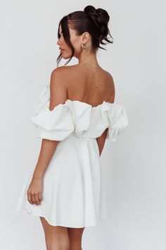 White mini dress Not lined Off-shoulder style Boning in bodice Zipper in back You'll look like you just stepped out of Heaven in our stunning Kailynn mini dress. We are loving its feminine, puffed neckline trim and off-shoulder style. Perfect for a bridal shower or birthday celebration. Team it with satin mules and a clutch for an unforgettable look. MODEL INFO Model is wearing size S Height: 5'2" Bust: 33.5" Waist: 25" Hips: 35" CARE Hand Wash Cold. Do Not Iron. MATERIAL POLYESTER/SPANDEX Short Off The Shoulder Dress, Bridal Brunch Dress, Picture Dress, Shower Dress, Outfit Options, Mini Dress White, Yellow Bridesmaids, Off Shoulder Fashion, Engagement Picture