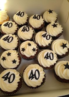 cupcakes with white frosting and black numbers on them