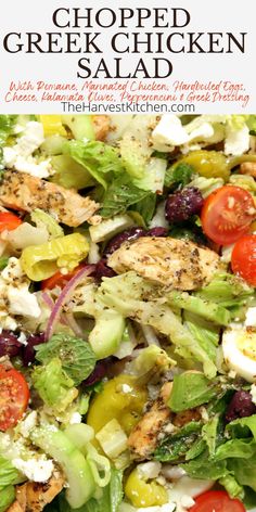 a salad with chicken, lettuce, tomatoes and feta cheese on it