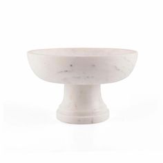 a white bowl sitting on top of a table