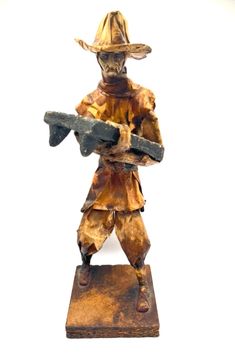 This Mexican paper mache figure is a beautiful representation of a man carrying a metate. Handmade with care, this folk art piece showcases the rich culture of Mexico. The figure has been crafted in Jalisco, a region known for its vibrant and colorful art. The attention to detail in this piece is remarkable, from the intricate design of the metate to the man's traditional clothing. It's a perfect addition to any collection of Mexican folk art or as a statement piece in any home. This unique item Mexico Culture, Mexican Culture, Mexican Folk Art, Paper Mache, Miniature Art, Traditional Outfits, Collectible Dolls, Colorful Art, Folk Art