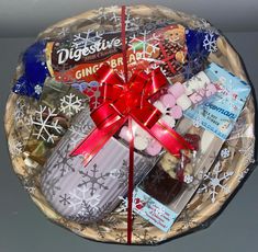 a gift basket filled with candy, candies and other holiday treats for someone special