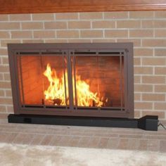 a fire burning inside of a fireplace in a living room