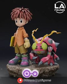 a small figurine is standing next to a smaller figure with an orange and pink hair