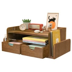 a wooden desk with drawers and books on it