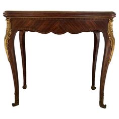 Nice console that unfolds to form a game table dating from the 19th century. This nice piece of furniture is in the Louis XV style, it has 4 curved legs. It is totally made of marquetry. These legs are dressed with brass falls with plant motifs and open at their ends with hooves. The legs are unfolded to enlarge the base. Then the top opens to increase its surface. The inside of the tray is covered with green velvet. 19th Century End Table, Victorian Games, Japanese Lamp, Table Flip, Console Game, Table 19, Narrow Console Table, Column Design, Game Table