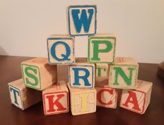 wooden blocks that spell out the word open, sit on a table