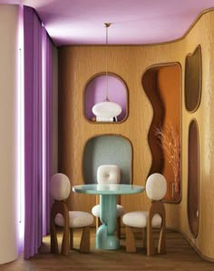 a dining room with purple walls and chairs around a glass table in front of a mirror