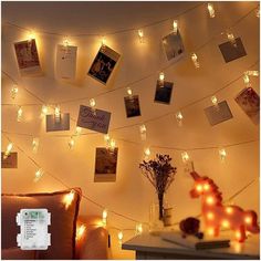 a living room with lights and pictures on the wall