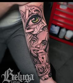 a woman's arm with an eye and roses on it