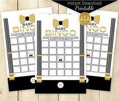 two baby shower game cards with gold bows on the front and back, in black and white