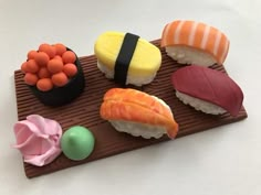 there are sushi on the plate with different toppings