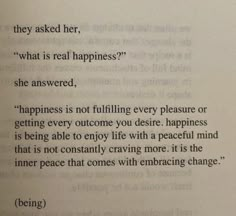 an open book with some writing on the page and a quote about happiness in it