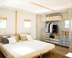 a bedroom with a bed and closet in it