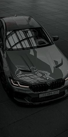 the front end of a black bmw car