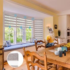 a woman sitting at a kitchen table in front of a window