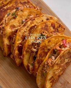 several quesadillas on a cutting board with the words pulled chicken tacos