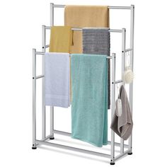 a towel rack with four towels hanging from it's sides and two folded ones on the other side