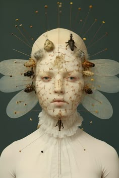 a woman's head with many insects on it